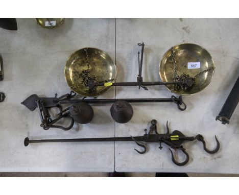 Two vintage iron steelyards, and an iron and brass balance scale 