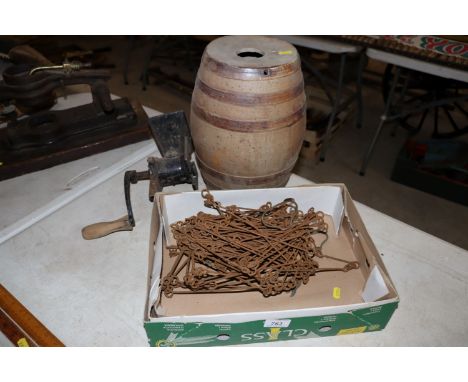 A vintage measuring chain, a stone glazed spirit barrel and a vintage mincer