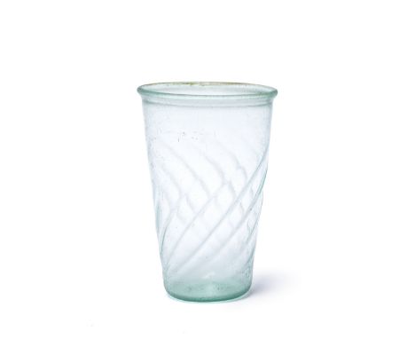  A Roman pale blue-green glass ribbed beaker Western Empire, circa 4th-5th Century A.D.With slightly everted and thickened ri