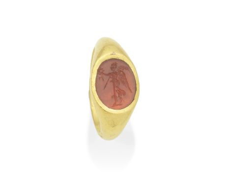  A Roman gold and carnelian intaglio ring with Nike Circa 1st-3rd Century A.D.The goddess standing in profile facing left, a 