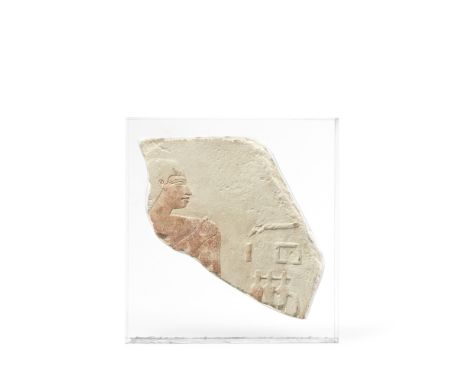  An Egyptian painted limestone relief Late First Intermediate Period - Middle Kingdom, circa 2000 B.C.Carved in shallow relie