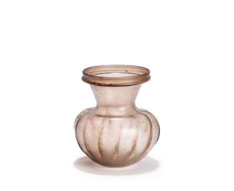  A Roman pale purple ribbed storage jar Circa 4th Century A.D.With flaring neck and collar rim, the spherical body with fourt