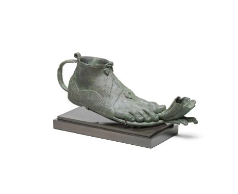  A large Roman bronze lamp in the form of a foot Circa 1st-2nd Century A.D.Lifesize and modelled naturalistically, the hollow