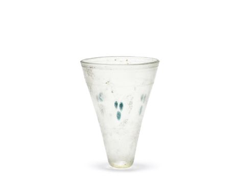  A Roman conical glass lamp Circa 4th-5th Century A.D.With cut-off rim, the conical body decorated with three groups of three