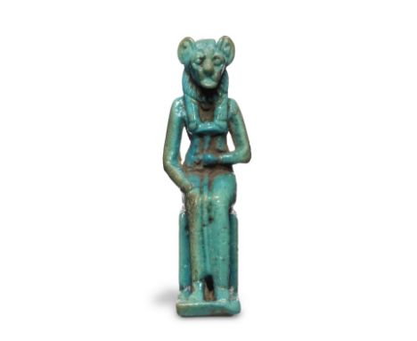 An Egyptian turquoise glazed faience amulet of a lion-headed goddess Third Intermediate Period, circa 1069-735 B.C.The lion-