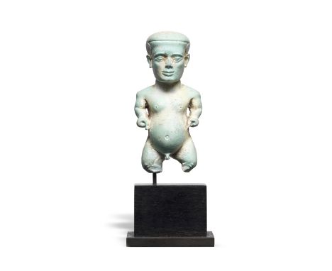  A sizeable Egyptian pale blue glazed faience Pataikos amulet Late Period, 26th Dynasty, circa 664-332 B.C.The protective dwa