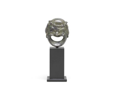  A Roman silver theatre mask in the form of a comic actor Circa 1st-2nd Century A.D.With exaggerated deeply furrowed brow, he