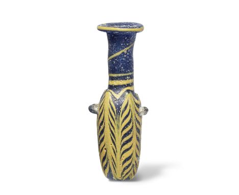  A Hellenistic core-formed glass alabastron Mid-2nd - mid-1st Century B.C.The cobalt blue body with two applied blue glass lu
