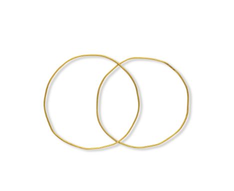  Two gold wire bracelets Possibly Late Bronze Age - Roman PeriodOf plain hoop form of tubular section,  5.5cm &amp; 5.8cm dia