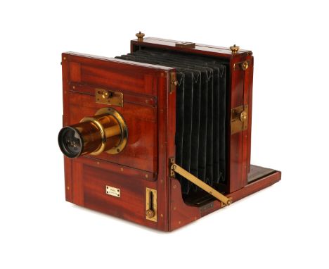 A Ross Full Plate Mahogany Tailboard Camera 1880, with Ross Rapid Symmetrical 10x8” brass lens, serial no. 31169, body, VG, b