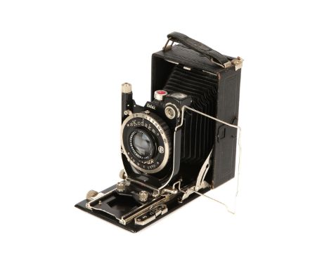 A Kodak Recomar 18 Camera, 1932-40, 6x9cm, black, serial no. 8652z, with Carl Zeiss Jena Tessar f/4.5 105mm lens, serial no. 