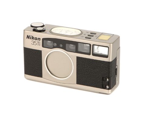 A Nikon 35Ti Compact Camera, 1993, titanium, serial no. 5007194, with Nikkor f/2.8 35mm lens, body, E, untested, lens, E, wit