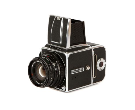 A Hasselblad 500C/M Medium Format Camera, 1980, chrome, serial no. RS1238898, with Carl Zeiss Planar T* f/2.8 80mm lens, blac