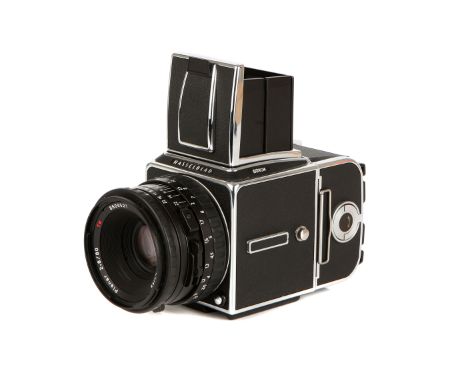 A Hasselblad 501C/M Medium Format Camera, 1999, chrome, serial no. 10EE19214, with Carl Zeiss Planar T* CB f/2.8 80mm lens, b