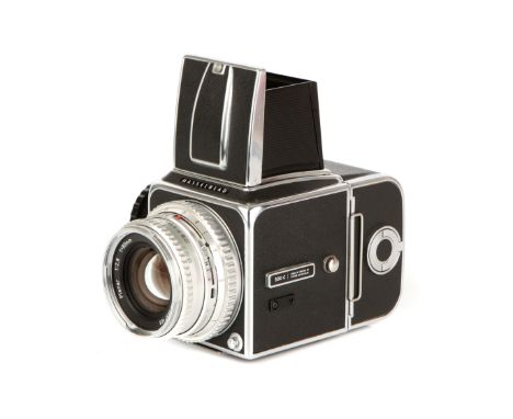 A Hasselblad 500C Medium Format Camera, 1964, chrome, serial no. TI56009, with Carl Zeiss Planar f/2.8 80mm lens, chrome, ser