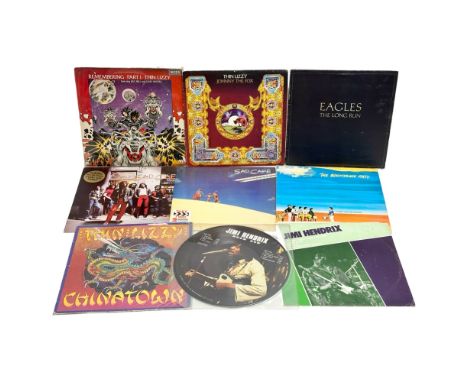 A collection of LP, vinyl records. Thin Lizzy, Eagles, Jimi Hendrix, Sad Cafe, The Boomtown Rats. 