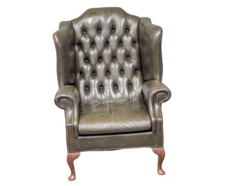 A Georgian style deep button leather wingback armchair. 5 