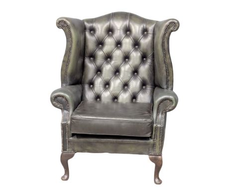 A Georgian style deep button leather wingback armchair.(1) 