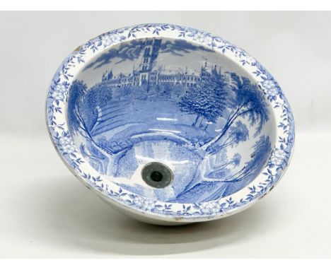 A Victorian blue and white ceramic sink/plug basin. 37x19cm 