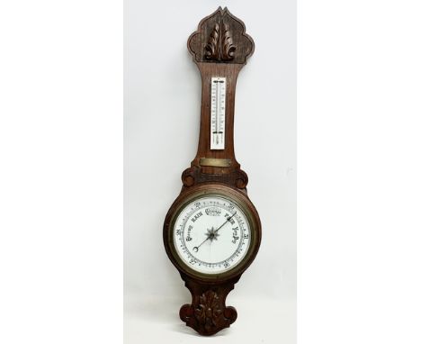 An Early 20th Century oak barometer. 85cm 
