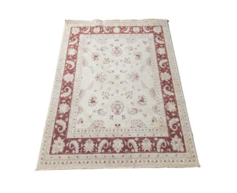 A vintage Middle Eastern style rug. 169x234cm 