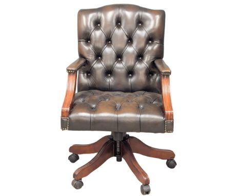 A Gainsborough style deep button leather swivel desk chair.(3) 