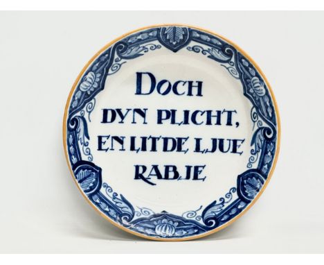 A Frisian delftware plate. Makers mark. Do your duty and let the people rage. 26cm. 
