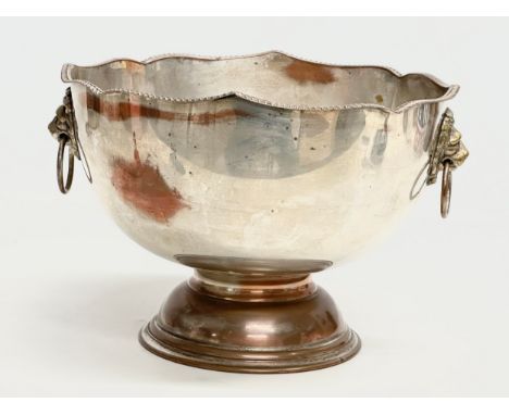 A good quality Early 20th Century silver plated footed ice bucket, with brass lion mask ring handles. Silver on copper. 30x26