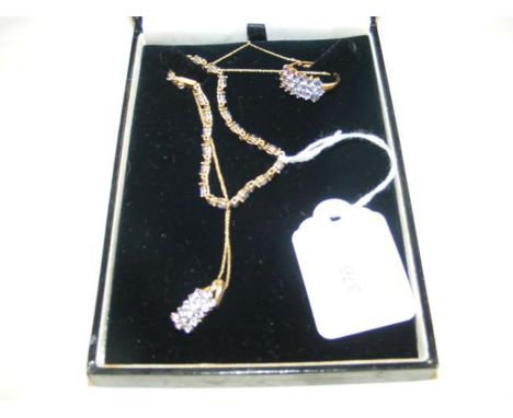 A suite of 10K gold jewellery, including pendant on chain, bracelet and ring 