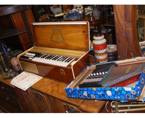 An electric box organ, together with a Scala auto harp 