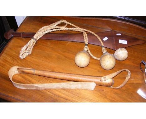A wooden Solomon Islands club - 74cm long, together with a vintage bolas, etc. 
