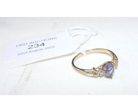 A 9ct gold ladies ring with pear shaped light blue stone