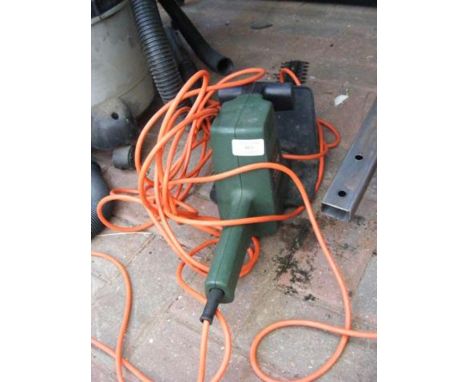 A Black and Decker GT150 power tool, together with electric chainsaw