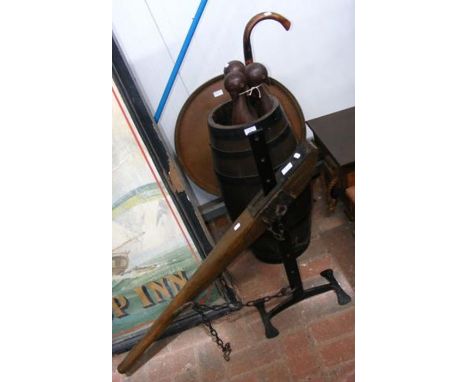 A metal bound stick stand, folding Middle Eastern table with wooden bird support, together with an unusual mounted boat tille