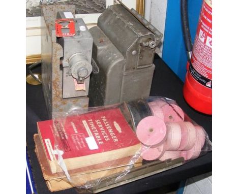 Two vintage railway ticket machines, together with timetables, spare ticket rolls, etc. 