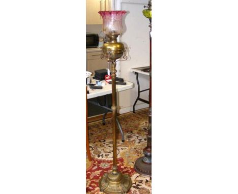 A heavy Victorian brass standard oil lamp CONDITION REPORT Height, 165cm.Does not separate, only oil reservoir can be removed