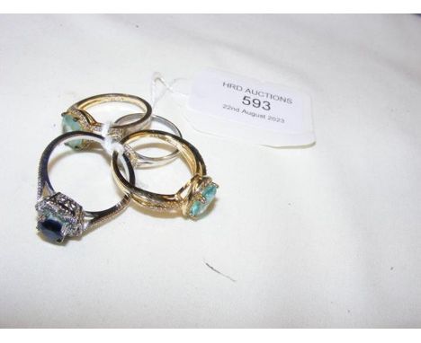 Four ladies dress rings  CONDITION REPORT Band sizes of the four rings are as follows:T, R, U 1/2, T