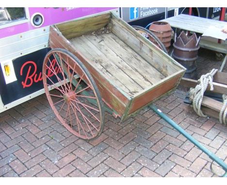 A vintage wooden and metal cart