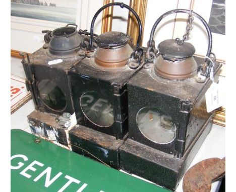 An S.R vintage railway lamp and two others 