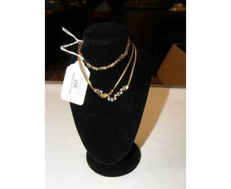A 9ct gold sapphire? pendant on chain, together with the matching bracelet 
