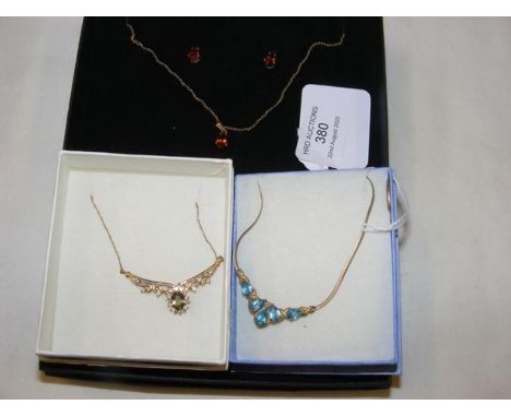 A 9ct gold pendant and chain, with the matching earrings, together with two pendants on chain 
