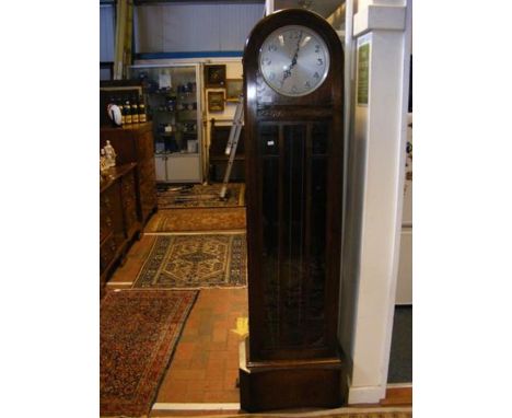 A 1930's oak cased Grandfather clock  CONDITION REPORT Functionality untested. Pendulum is included.