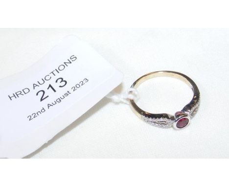 A new 9ct ruby and diamond dress ring