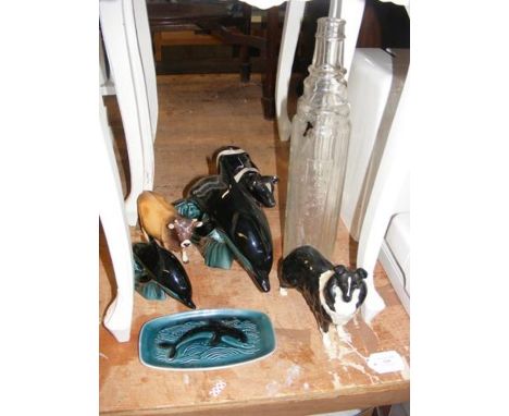 A Beswick Collie ornament, together with other Beswick and Poole Pottery and a vintage Essolube glass bottle 