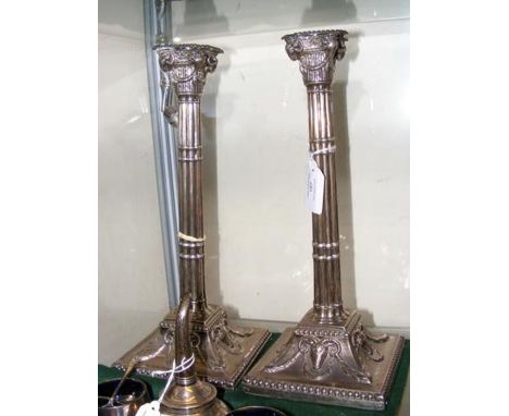 A pair of elegant George III corinthian column silver candlesticks, London 1772 with rams head embellishment - 32cms high CON