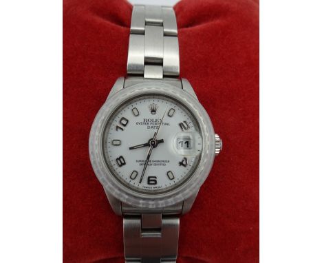 LADIES STAINLESS STEEL ROLEX OYSTER PERPETUAL DATE, WHITE DIAL, ENGINE TURNED BEZEL, OYSTER BRACELET. MODEL 79240 CASE NUMBER