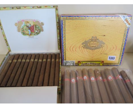 An unopened box of Flor de Tabacos Portages with an opened box of 23 Romeo and Juliet Churchill cigars and approximately 23 u