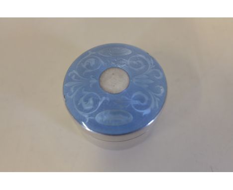 A circular silver pill box with blue enamel decoration, approx 0.8 troy oz, some losses to enamel near rim 