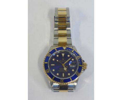 A gentleman's Rolex oyster perpetual automatic submariner wristwatch, with blue dial, bi metal bracelet, box, papers, Rolex o