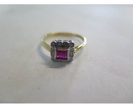 An 18ct gold diamond and ruby ring, size N, approx 2.7 grams, ruby approx 4mm x 4mm - good overall condition 